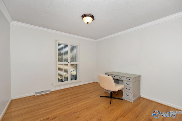 unfurnished office with crown molding, a textured ceiling, and light hardwood / wood-style floors