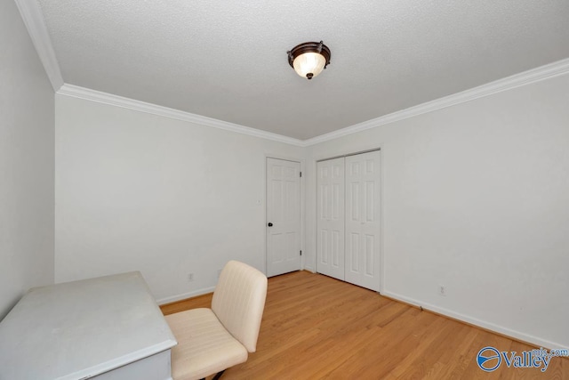 home office with ornamental molding, a textured ceiling, and light hardwood / wood-style flooring