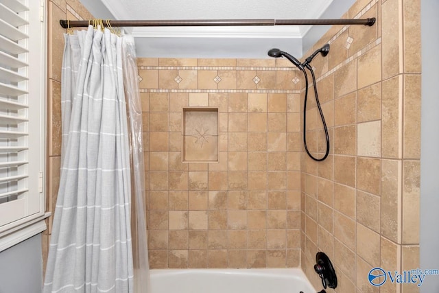 bathroom featuring shower / bath combo and crown molding