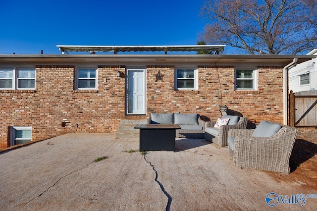 back of property with a patio and outdoor lounge area