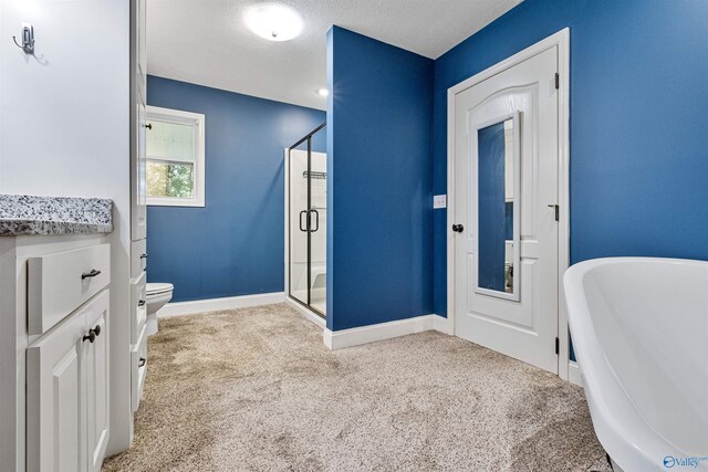 full bathroom with toilet, vanity, a textured ceiling, and shower with separate bathtub