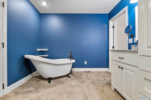 carpeted office space with a textured ceiling