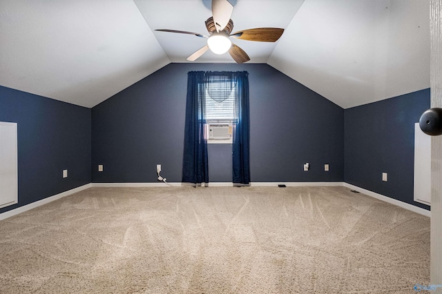 bonus room featuring ceiling fan, carpet, and vaulted ceiling