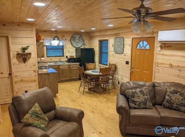 interior space featuring wooden walls, a wall mounted air conditioner, wood ceiling, and light hardwood / wood-style flooring