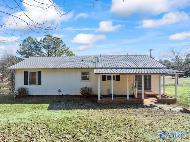 back of house with a yard