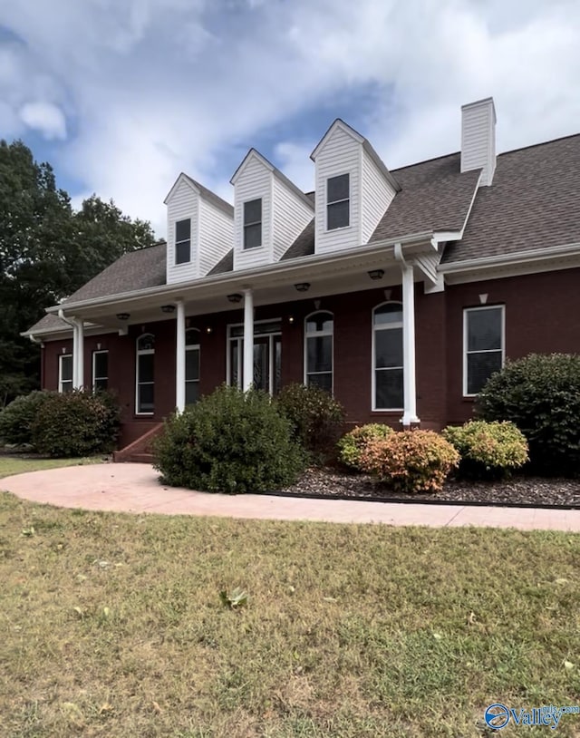 302 Lipscomb Cir, Laceys Spring, AL 35754 - cape cod house with a front yard, a chimney, and roof with shingles