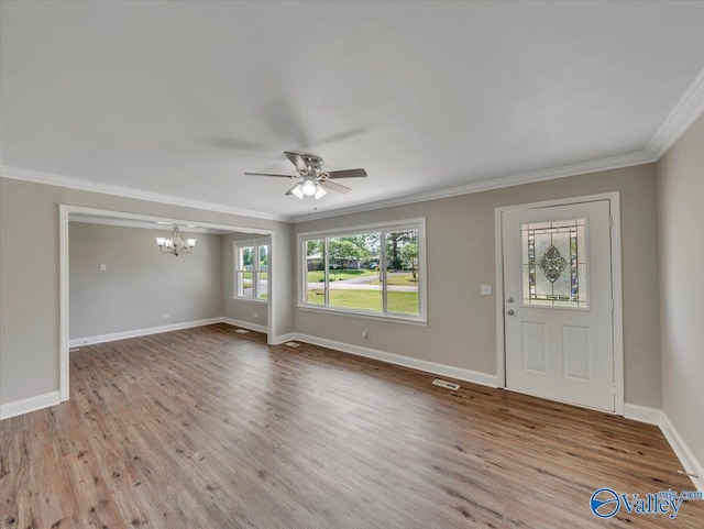 1419 11th St SE, Cullman, AL 35055 - entryway with baseboards, ornamental molding, ceiling fan with notable chandelier, and wood finished floors