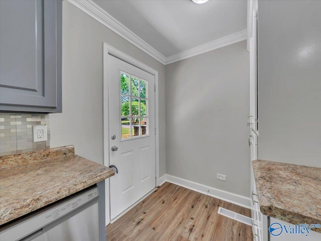 1419 11th St SE, Cullman, AL 35055 - doorway to outside with crown molding, light wood-style flooring, baseboards, and visible vents