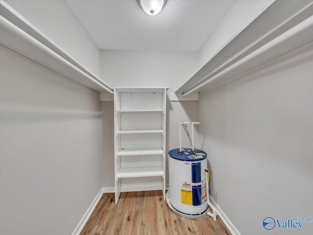 1419 11th St SE, Cullman, AL 35055 - spacious closet featuring water heater and wood finished floors