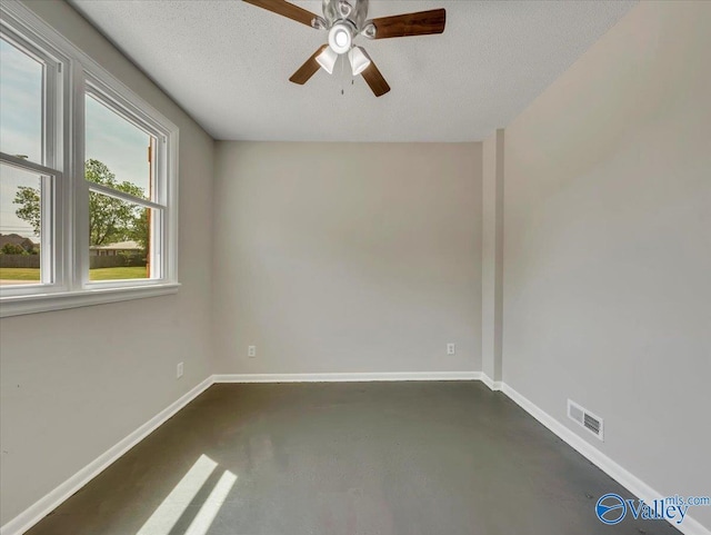 1419 11th St SE, Cullman, AL 35055 - unfurnished room featuring baseboards, a ceiling fan, finished concrete floors, and visible vents