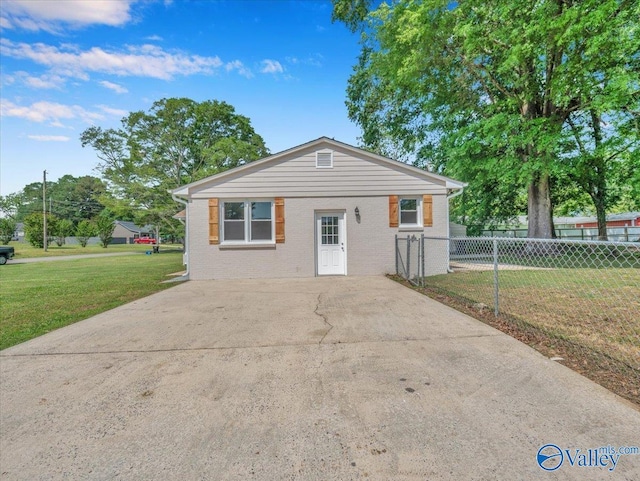 1419 11th St SE, Cullman, AL 35055 - bungalow-style home with fence, concrete driveway, brick siding, and a front yard