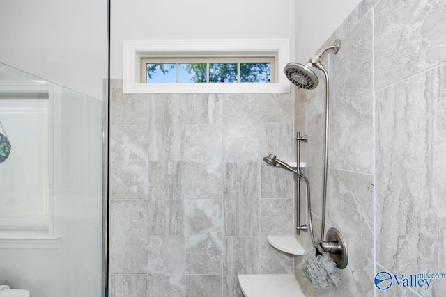 full bathroom with a tile shower