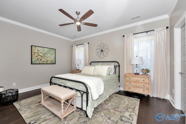 bedroom featuring ceiling fan, wood finished floors, visible vents, baseboards, and ornamental molding