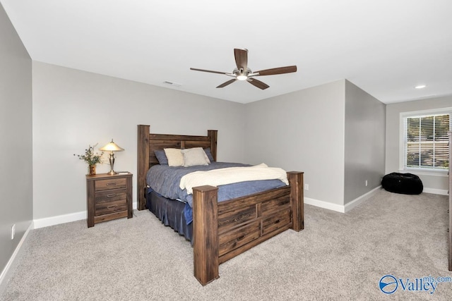 bedroom featuring a ceiling fan, baseboards, visible vents, and carpet flooring