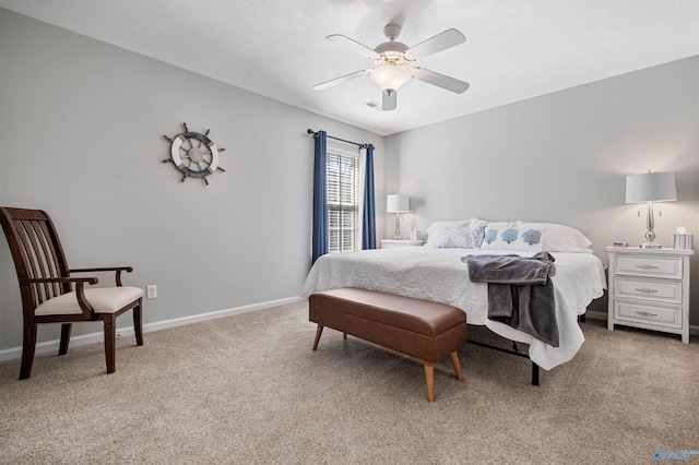 bedroom with a ceiling fan, visible vents, baseboards, and light carpet