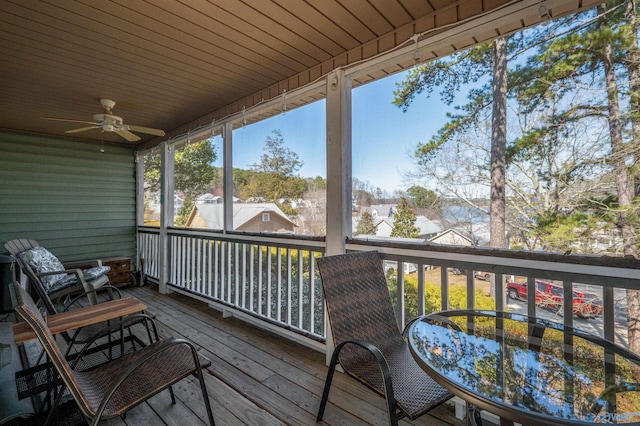 wooden terrace with a ceiling fan