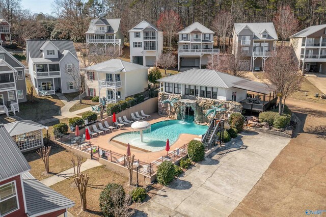 pool with a residential view and fence