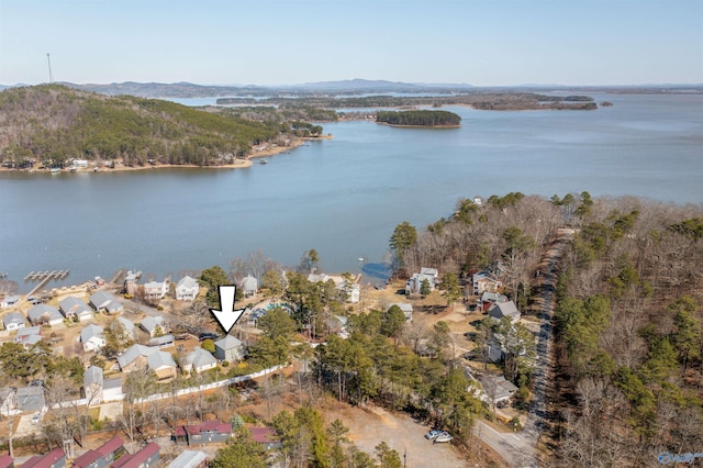 aerial view featuring a water and mountain view