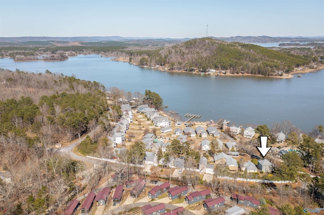 drone / aerial view featuring a residential view and a water and mountain view