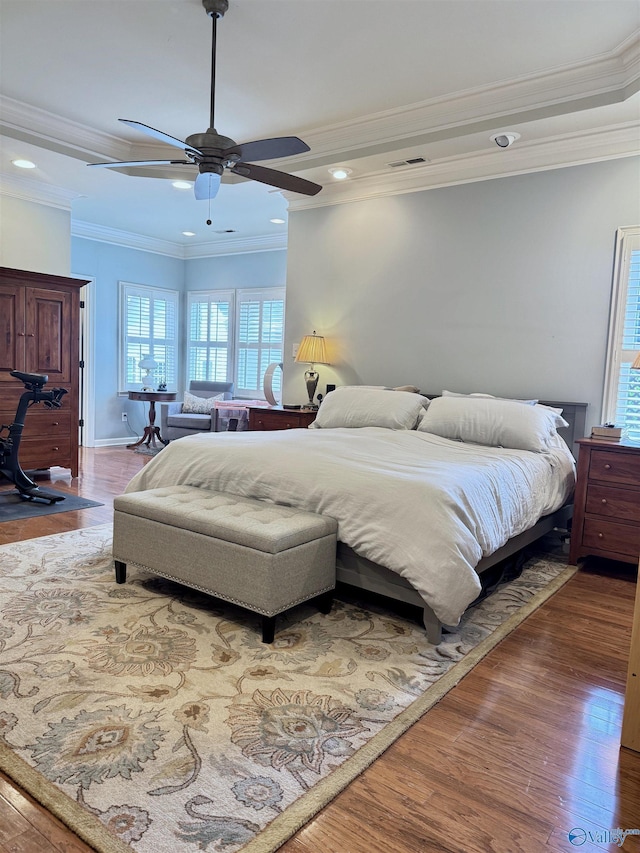 3205 Germantown Pl, Decatur, AL 35603 - bedroom featuring multiple windows, wood finished floors, recessed lighting, crown molding, and ceiling fan