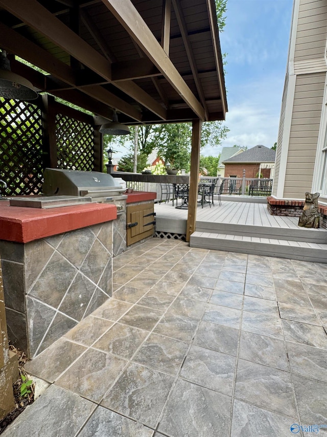 3205 Germantown Pl, Decatur, AL 35603 - view of patio with exterior kitchen, a deck, and outdoor dining space