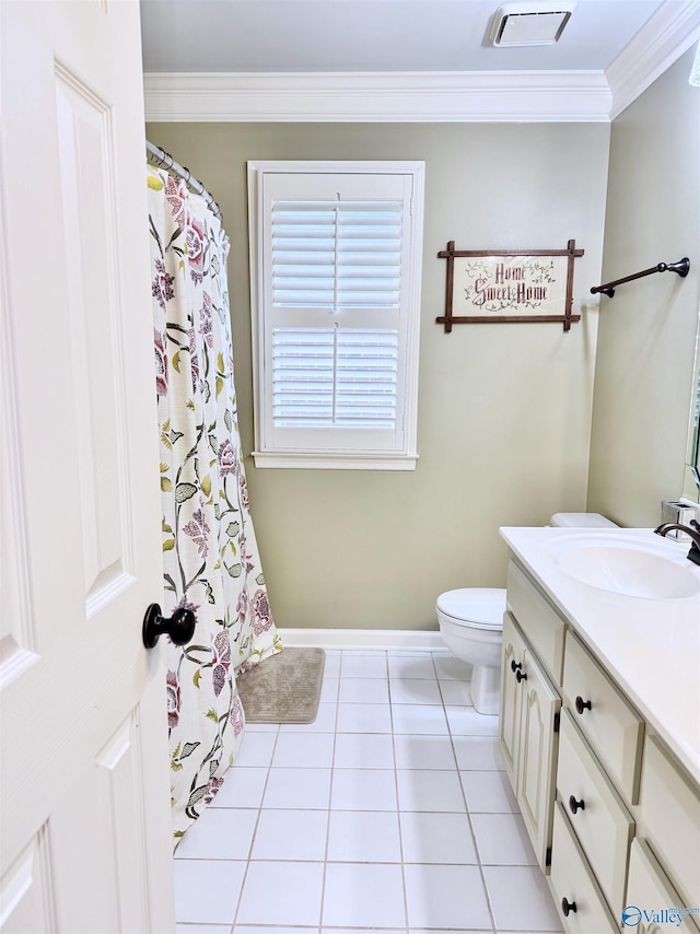 3205 Germantown Pl, Decatur, AL 35603 - full bath with ornamental molding, vanity, toilet, baseboards, and tile patterned floors