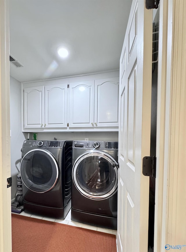 3205 Germantown Pl, Decatur, AL 35603 - washroom with cabinet space, washing machine and clothes dryer, light tile patterned flooring, and recessed lighting
