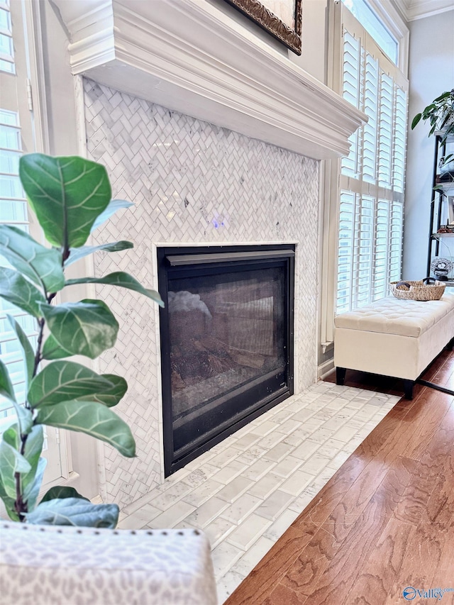 3205 Germantown Pl, Decatur, AL 35603 - detailed view of a tile fireplace, wood finished floors, and crown molding