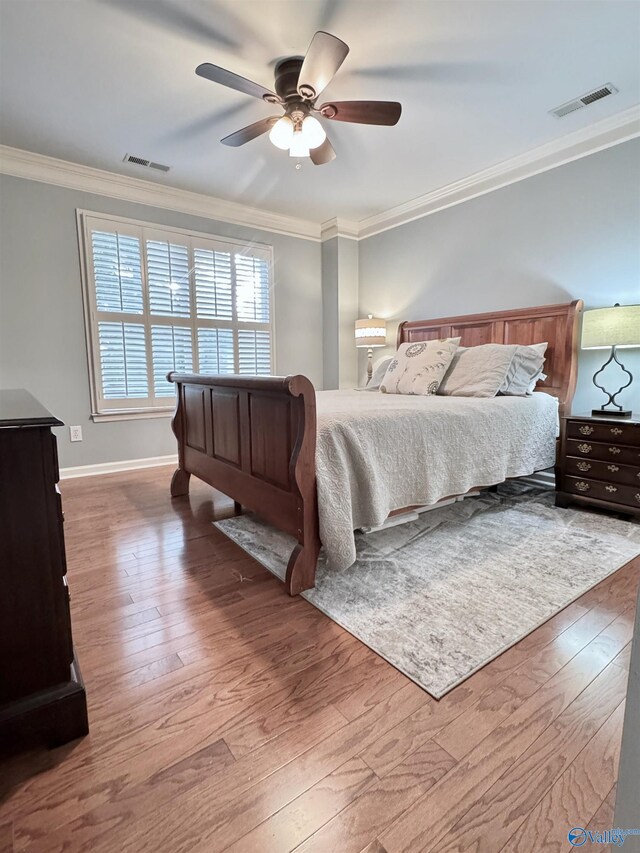3205 Germantown Pl, Decatur, AL 35603 - bedroom with wood-type flooring, ornamental molding, baseboards, and a ceiling fan