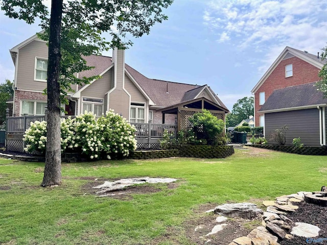 3205 Germantown Pl, Decatur, AL 35603 - back of property featuring a deck, brick siding, a chimney, and a lawn