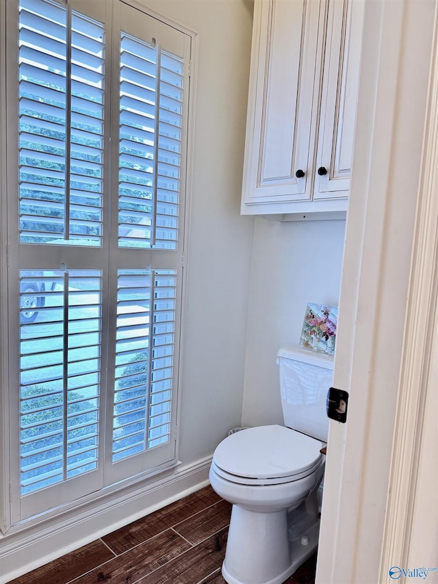3205 Germantown Pl, Decatur, AL 35603 - bathroom with wood finished floors, baseboards, and toilet