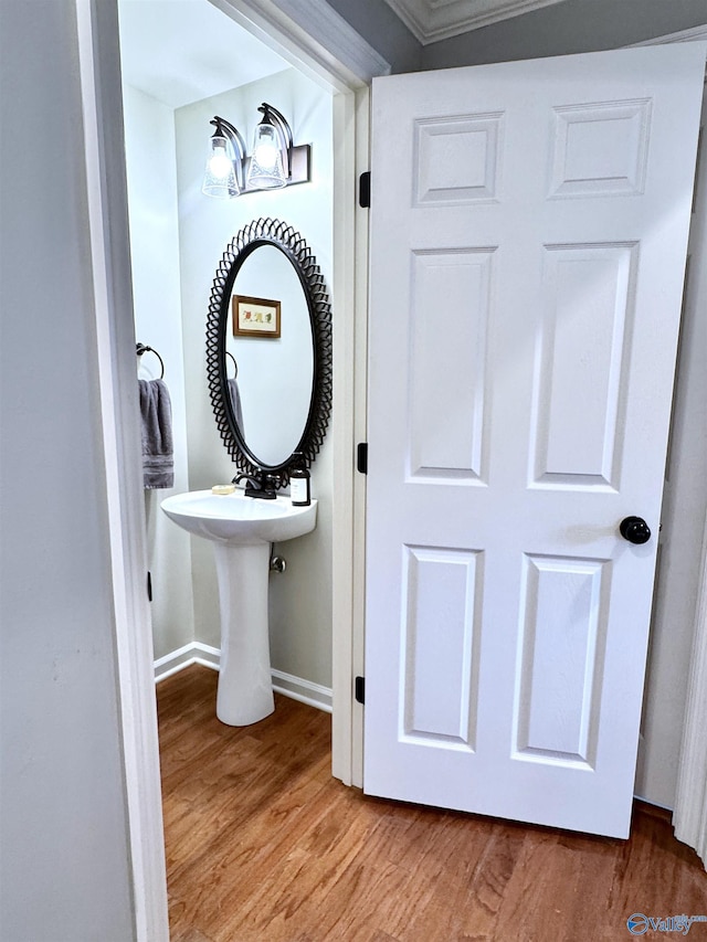 3205 Germantown Pl, Decatur, AL 35603 - bathroom with wood finished floors, baseboards, and ornamental molding