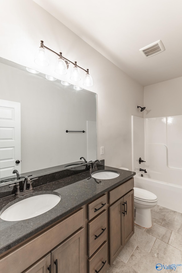 full bathroom with shower / bath combination, vanity, and toilet