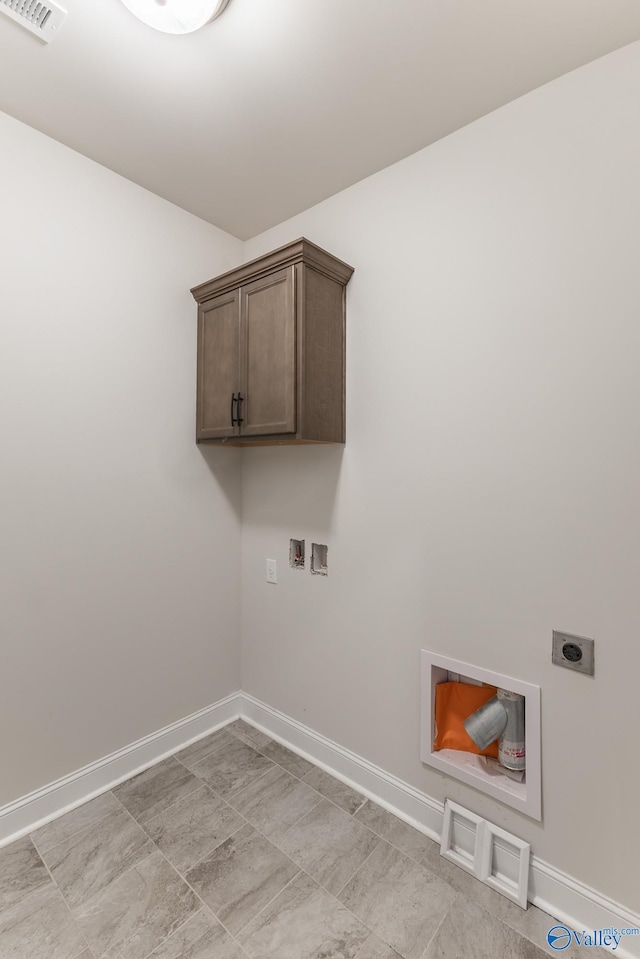 laundry room featuring washer hookup, cabinets, and hookup for an electric dryer