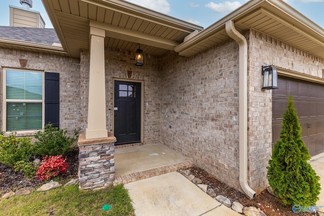 entrance to property featuring a garage