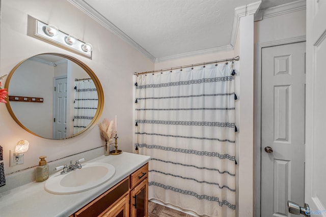 bathroom with a textured ceiling, parquet floors, crown molding, and vanity