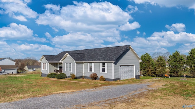 view of front facade with a front lawn and a garage