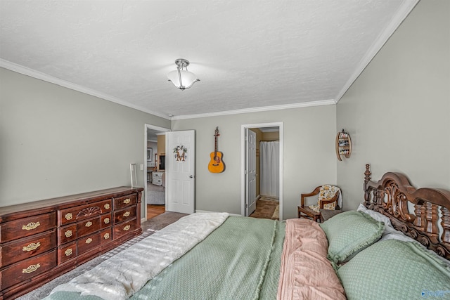 bedroom with a textured ceiling and crown molding