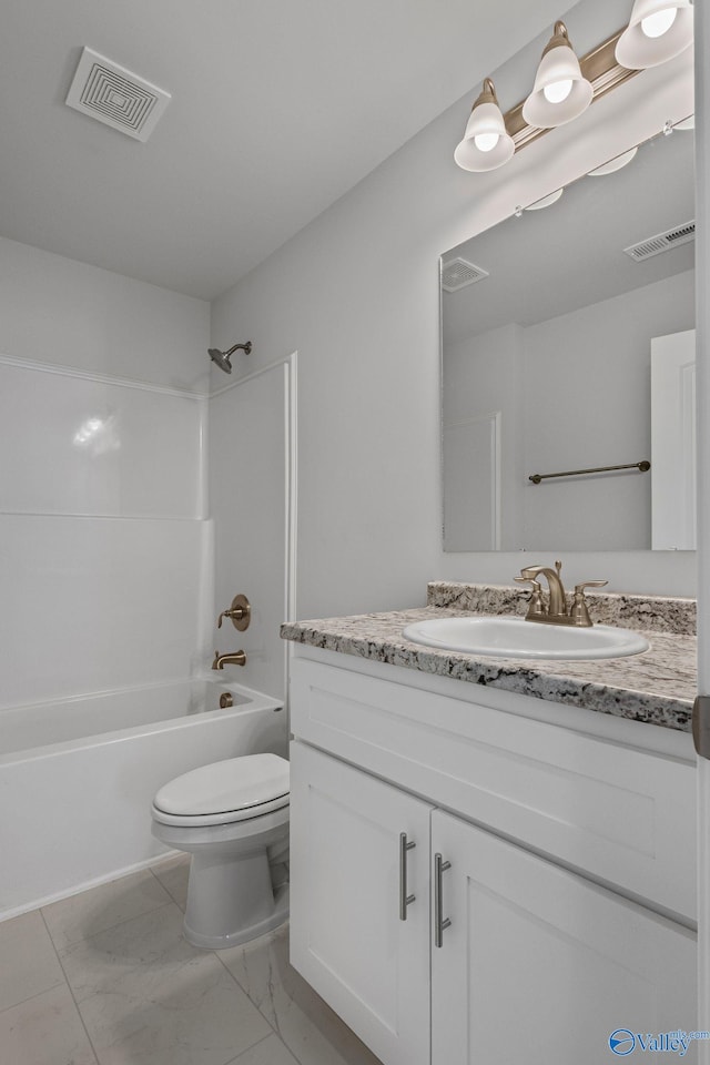 bathroom featuring marble finish floor, visible vents, vanity, and toilet