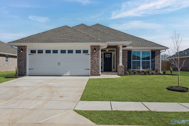 view of front of property with brick siding, an attached garage, a front lawn, and roof with shingles