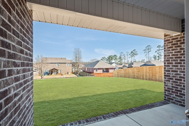 view of yard with fence and a residential view