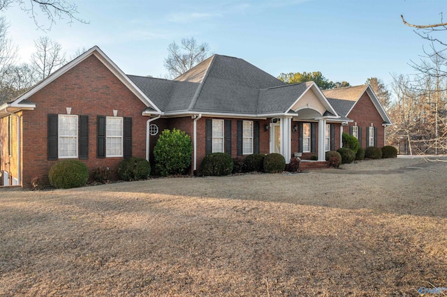 ranch-style house with a front yard