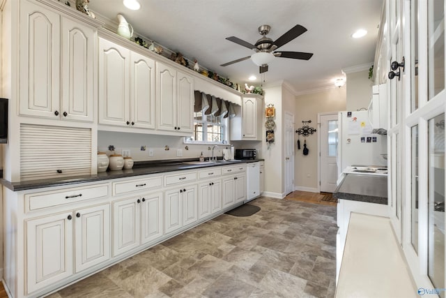 kitchen with sink, crown molding, ceiling fan, white cabinetry, and white dishwasher