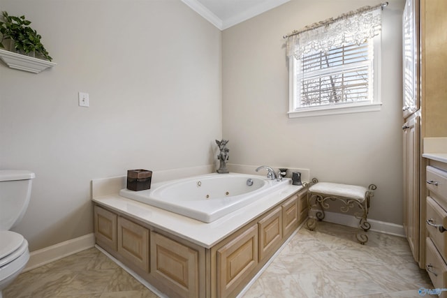 bathroom featuring vanity, a bathtub, ornamental molding, and toilet