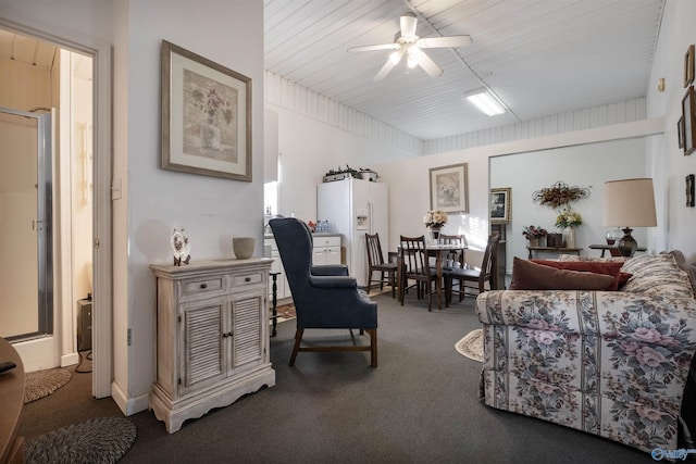 living room featuring ceiling fan and carpet flooring