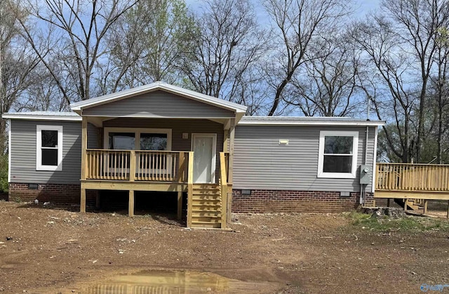 manufactured / mobile home with crawl space and covered porch