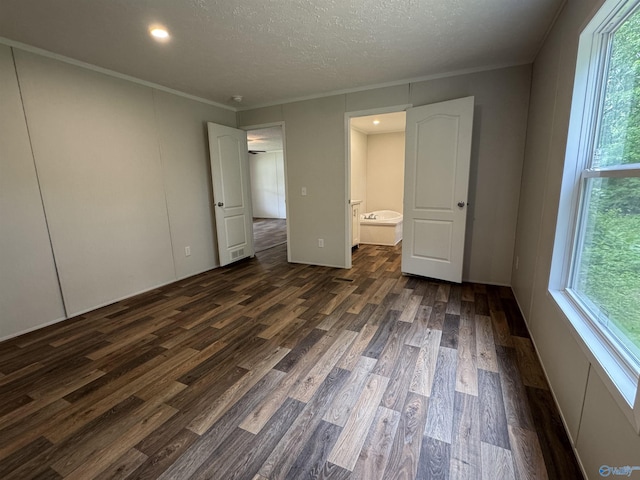 1101 Mcdonald St, Fayetteville, TN 37334 - unfurnished bedroom with dark wood-type flooring, ensuite bath, recessed lighting, a textured ceiling, and ornamental molding