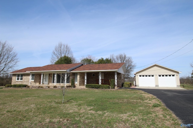 ranch-style house featuring a garage and a front lawn