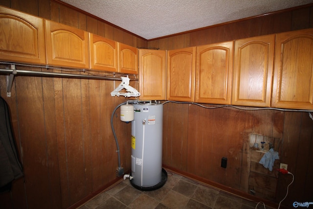 utility room featuring water heater