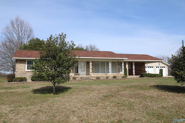 ranch-style home featuring a garage and a front lawn